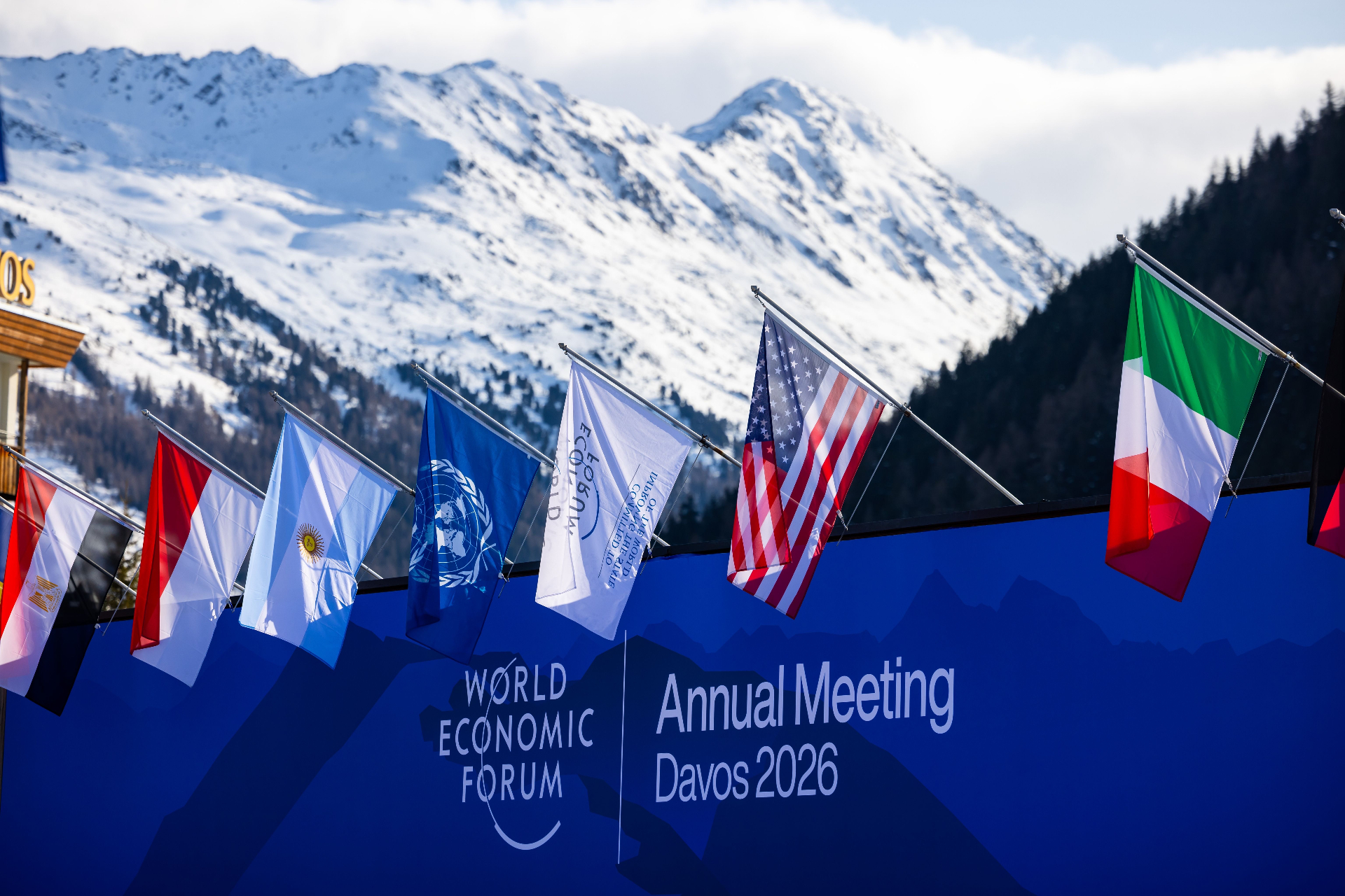 World Economic Forum flags in front of the Davos alps